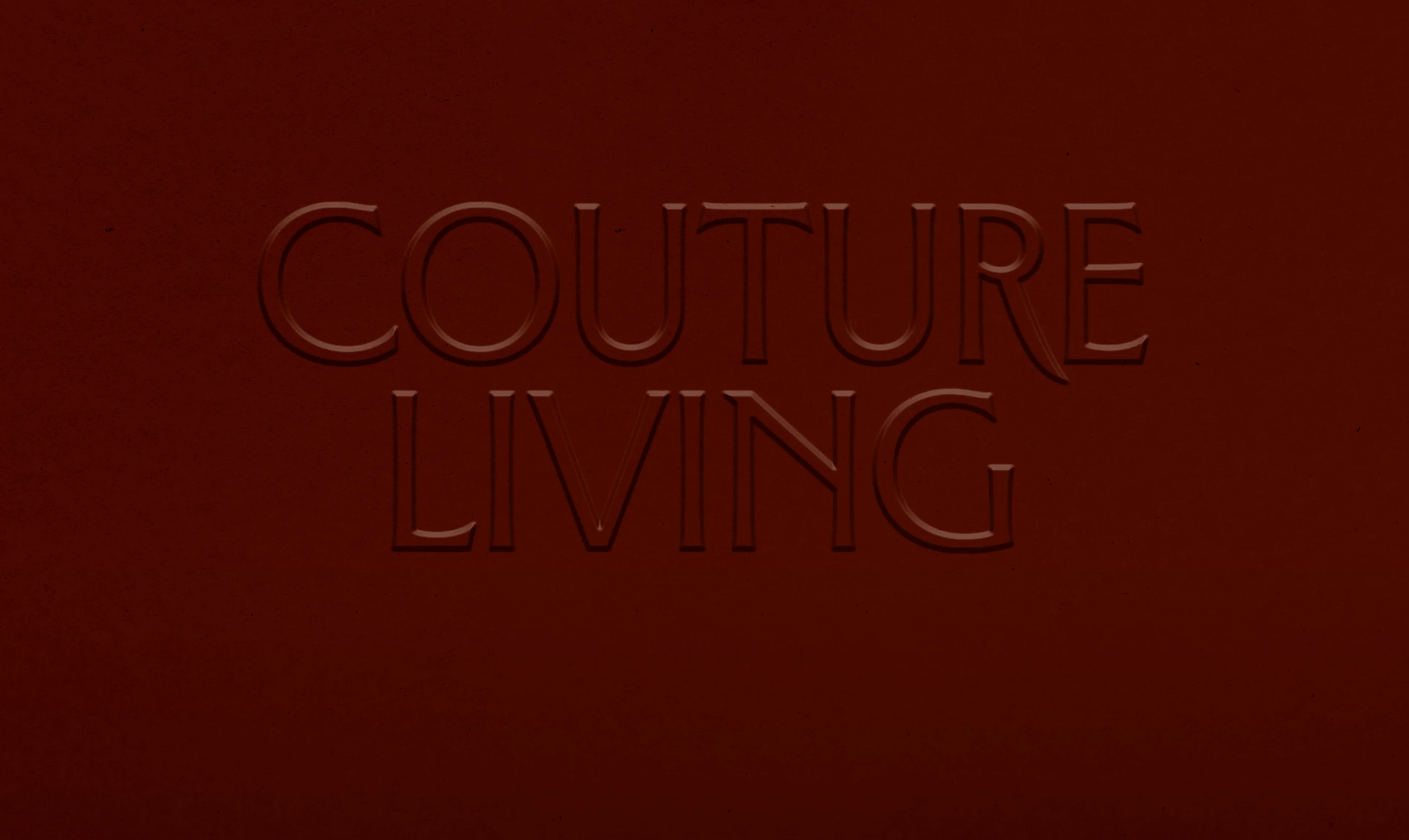 Couture Living wordmark embossed on a burgundy panel